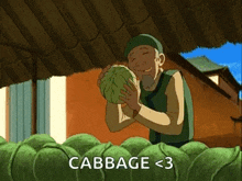 a cartoon of a man holding a cabbage with the words cabbage < 3 above him .