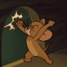 jerry from tom and jerry is standing in front of a door with his fist up in the air