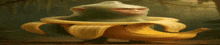 a monkey is sitting on a banana peel in a painting .