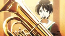 a young girl is playing a trumpet in a band