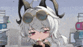 a cartoon character with horns is drinking from a cup