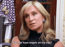 a woman in a black top is asking do i not have angels on my side