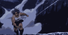 a man in a white tank top and black shorts is running in a cave .