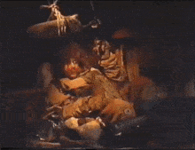 a man in a brown jacket is holding another man in a yellow jacket