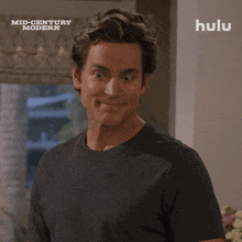 a man wearing a t-shirt that says mid century modern