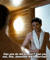 a shirtless man with a towel around his neck is standing in front of a mirror in a bathroom .