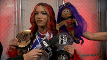 a woman holding a microphone with the word aew on it