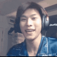 a man wearing headphones with ducky written on the side