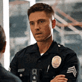 a police officer with a badge that says ' angeles police department '