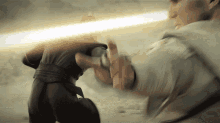 a person is holding a light sword in their hand