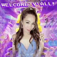 a woman in a blue dress stands in front of a welcome y all sign