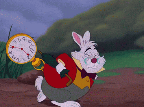 GIF of a rabbit hopping quickly with a pocket watch clipped to his waist.