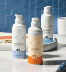three bottles of avon solutions are on a table