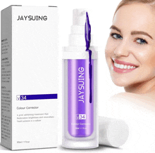 a woman is smiling next to a bottle of jaysuing