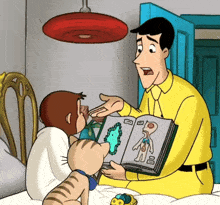 a man in a yellow shirt is reading a book to a monkey and a cat