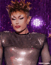a close up of a drag queen 's face with a purple background and the words t4yce tumblr on the bottom