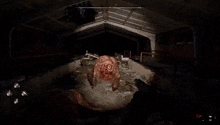 a video game is being played in a dark room with a large monster .