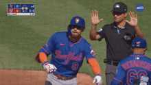 a baseball player wearing a new york jersey walks towards the umpire