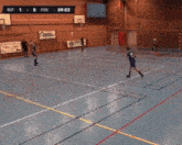 a basketball game is being played in a gym and the score is 0-0