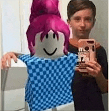 a boy is taking a selfie with a roblox character in a blue shirt .