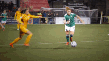 playing football marissa callaghan northern ireland passing the ball kicking the ball