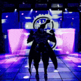 a silhouette of a robot standing in front of a stage with purple lights