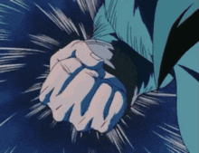a close up of a person 's fist in a blue background