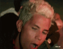 a close up of a man 's face with the words rbd.gif written below it