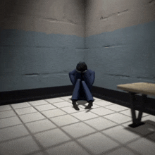 a man in a blue suit sits in a corner of a room with his head in his hands