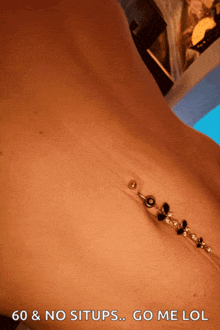 a close up of a person 's belly with the words 60 & no situps go me lol