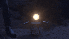 a person standing in the dark with a bright light shining on them
