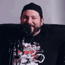 a man wearing a black shirt that says insane