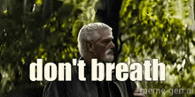 a man with a beard says do n't breath in front of trees