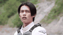 a young man wearing a vest that says flying tiger