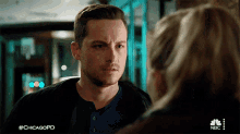 a man and a woman are looking at each other with the hashtag #chicagopd on the bottom