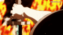 a person is holding a sword in front of a fire with the words barathe.xyz written on the bottom