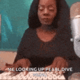 a woman is typing on a keyboard while looking up pearl dive .