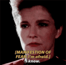 a close up of a woman 's face with the words " manifestation of fear i 'm afraid "