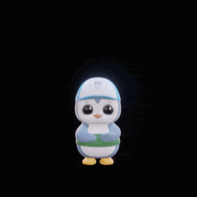 a stuffed penguin wearing a blue hat and a green scarf