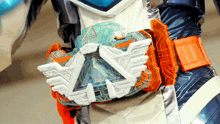 a person is wearing a belt with a white triangle on it