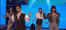 a group of women are dancing on a stage