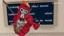 a picture of a gorilla standing in front of a chalkboard that says taily rocks