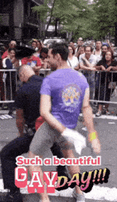 a man in a purple shirt is being lifted by a police officer with the caption such a beautiful gayday !!!