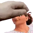 a close up of a woman 's face with a hand covering it .