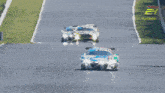 a race car is going down a track with a time of 03:54:01