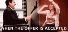 a man and a woman are shaking hands in an office and the woman is sitting in a chair .