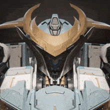 a close up of a robot 's head with a horn