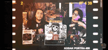 a kodak portra 400 film strip with two men and a nirvana album