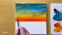 a person is painting a sunset on a canvas with the words made in animatica below it