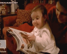 Baby Thinks She Can Eat Food From The Magazine GIF - Baby Food Magazine GIFs